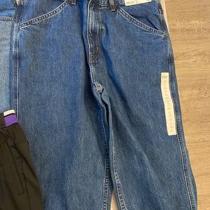 Uniqlo jeans and sports wear.